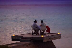 romantic couple have outdoor dinner photo
