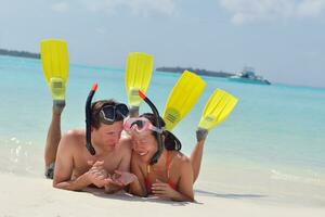 happy young couple have fun on beach photo