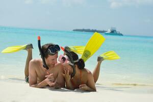 happy young couple have fun on beach photo