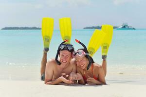 happy young couple have fun on beach photo