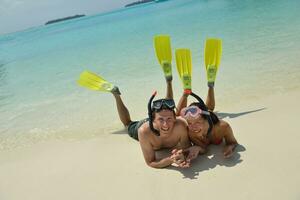 happy young couple have fun on beach photo