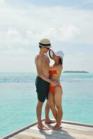 happy young couple have fun on beach photo