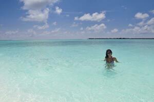 beautiful young woman  on beach have fun and relax photo