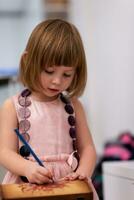 little girl painting jewelry box photo