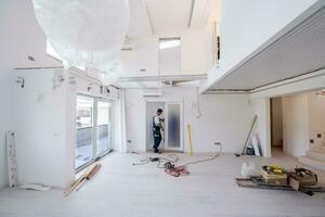 carpenters installing glass door with a wooden frame photo