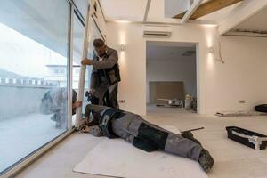 carpenters installing a balcony door photo