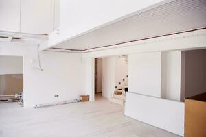 Interior of empty stylish modern open space two level apartment photo