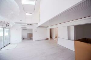 Interior of empty stylish modern open space two level apartment photo