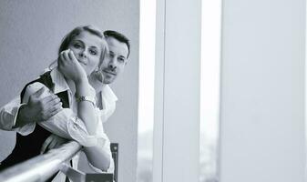 romantic happpy couple on balcony photo