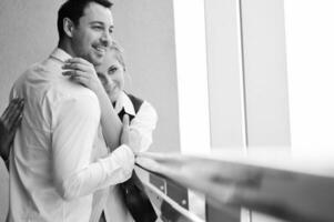 romantic happpy couple on balcony photo