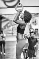 black woman doing dipping exercise photo