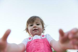 little girl spending time at backyard photo