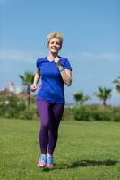 young female runner training for marathon photo