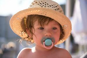 tired little girl resting on sunbed photo