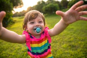 little girl spending time at backyard photo