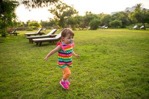 little girl spending time at backyard photo