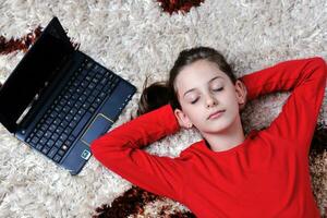 happy school girl relaxing at home photo