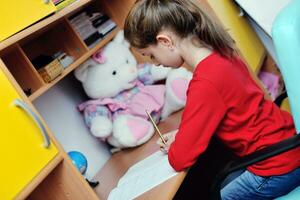 girl doing homework photo