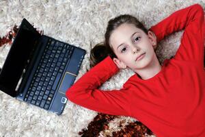 happy school girl relaxing at home photo