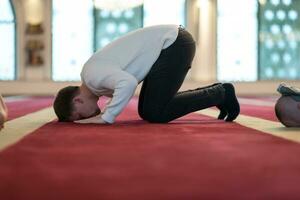 man performing sajdah in namaz photo