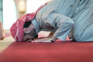 man performing sajdah in namaz photo