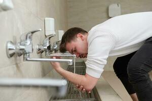 A Muslim takes ablution for prayer. Islamic religious rite photo