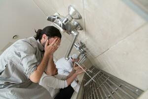 a group of Muslims take ablution for prayer. Islamic religious rite photo