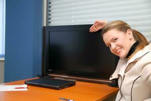 business woman pointing on screen photo