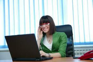 .young businesswoman working on a laptop computer in the office. photo