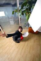 happy businesswoman throwing documents in office photo