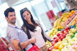 couple shopping in a supermarket photo