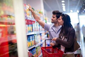 couple shopping in a supermarket photo