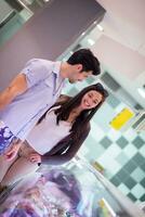 couple shopping in a supermarket photo