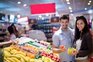 couple shopping in a supermarket photo