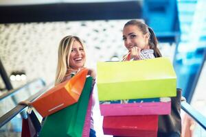 happy young girls in  shopping mall photo