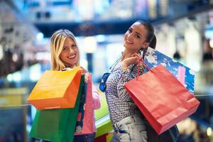 happy young girls in  shopping mall photo