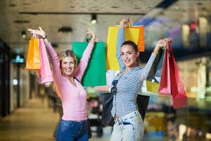 happy young girls in  shopping mall photo