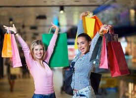 happy young girls in  shopping mall photo