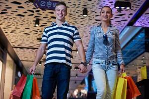 young couple with shipping bags photo