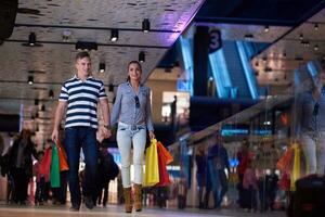 young couple with shipping bags photo