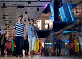 young couple with shipping bags photo