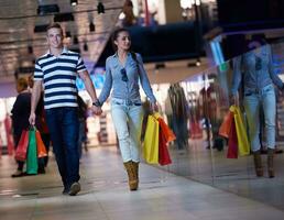 young couple with shipping bags photo