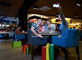friends have lanch break in shopping mall photo