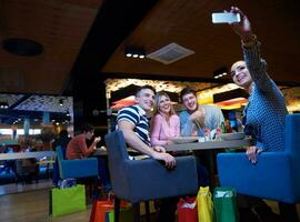 friends have lanch break in shopping mall photo