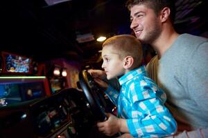 father and son playing game in playground photo