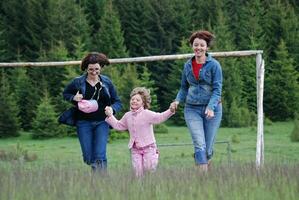 happy girls running in nature photo