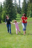 happy girls running in nature photo