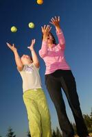 Food balancing concept with girls in nature photo