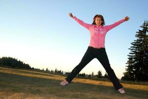 pretty girl jumping in a air photo