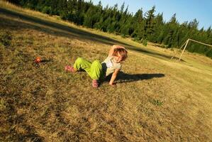 happy girl throwing apple outside photo